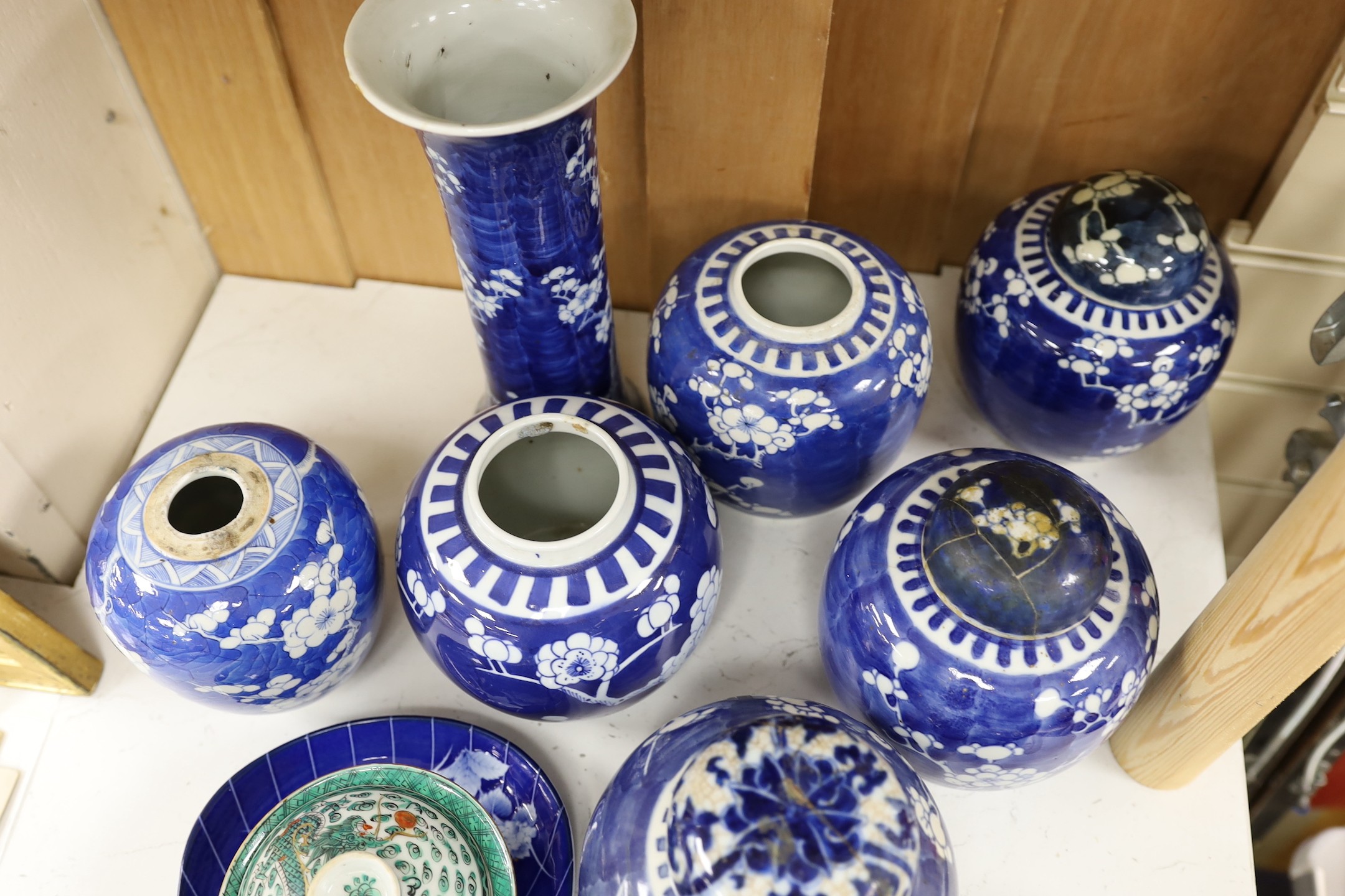 Eight Chinese blue and white ginger jars, one prunus vase and two others, the vase 25 cm high